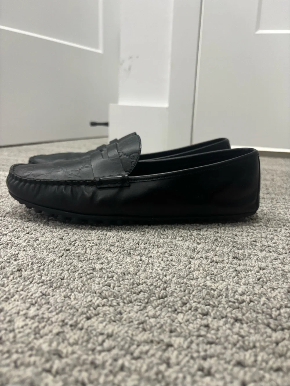 Gucci Black GG Embossed Leather Penny Loafers